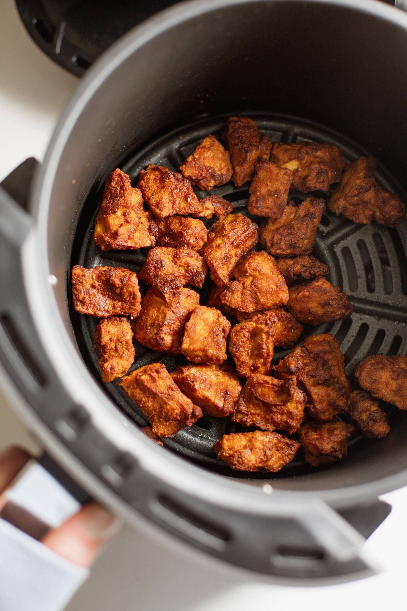 Crispy tofu in an air fryer.