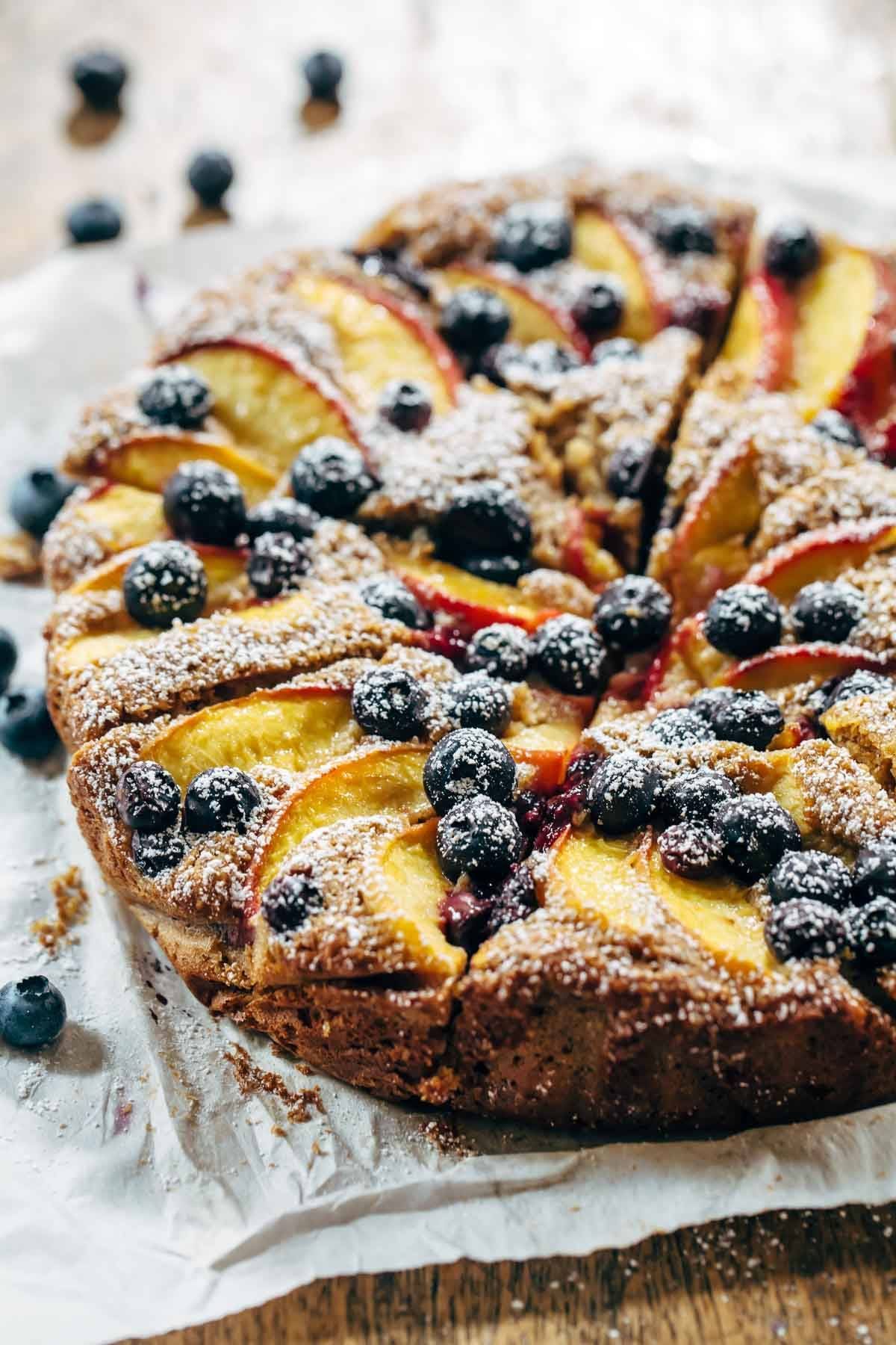 A blueberry peach cake on a towel.