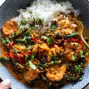 Shrimp curry in a bowl with rice.